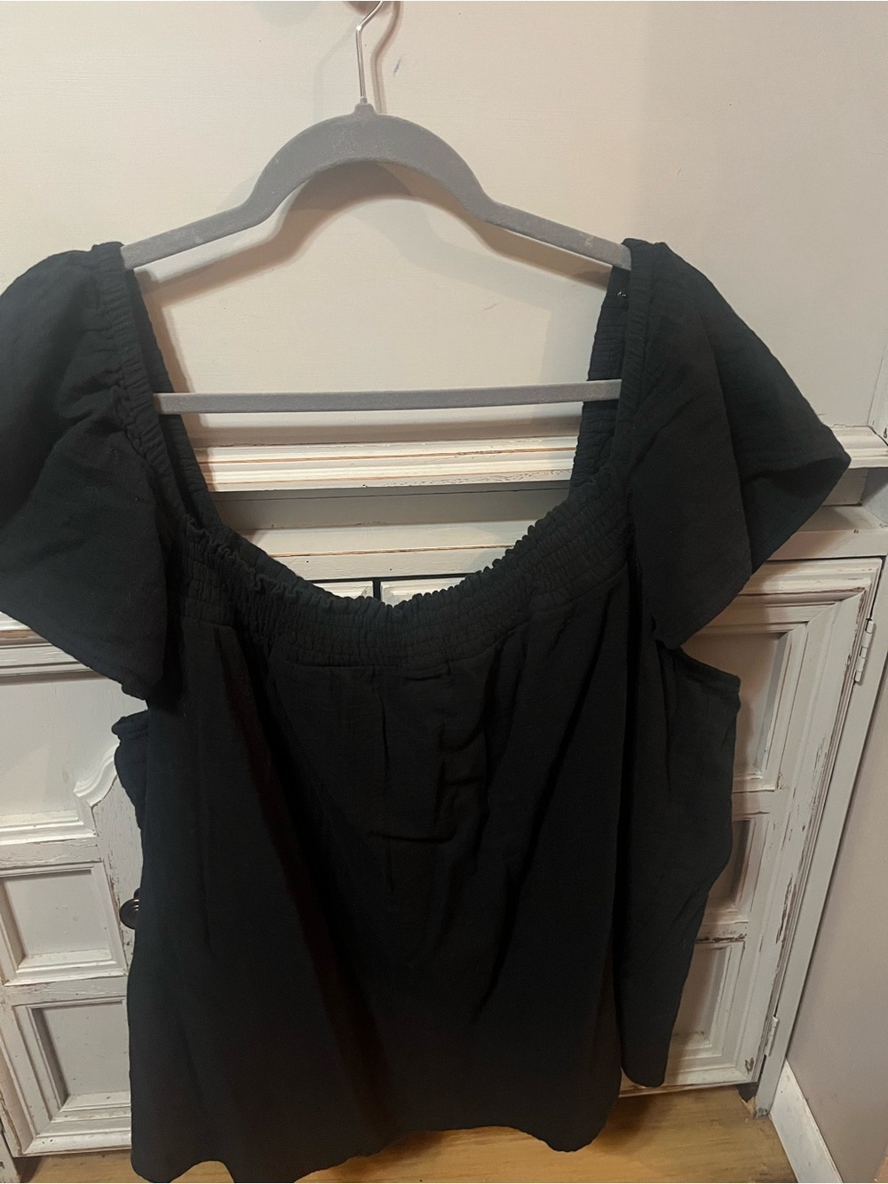 Black Off-Shoulder Smocked Neck Tunic flutter sleeve top.